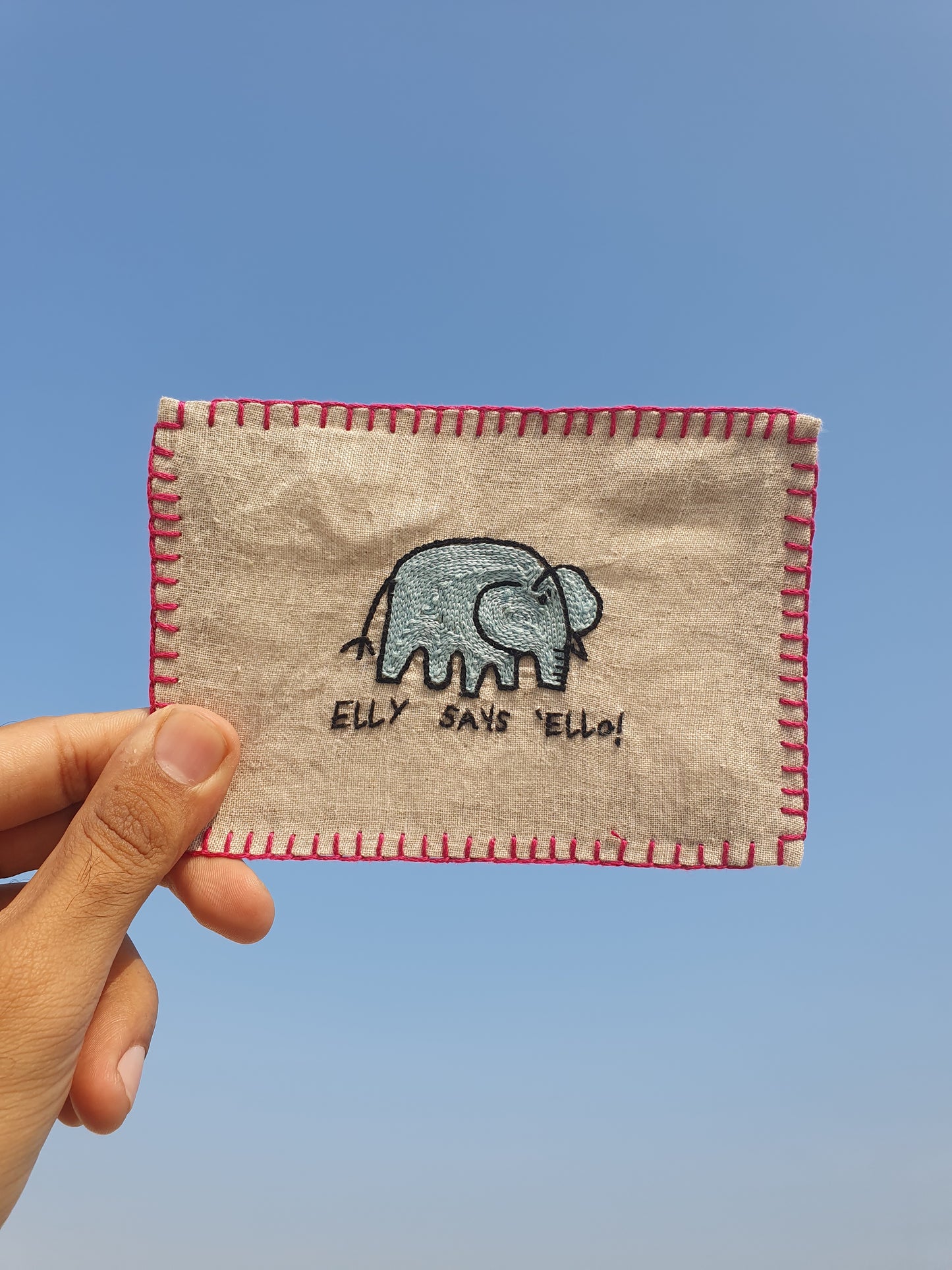 Hand-embroidered postcard featuring Elly the Elephant, who is ready to send a 'Hello' from your side