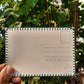 Back side of the hand-embroidered postcard showing the 225 gsm textured paper, ideal for writing with a ball pen