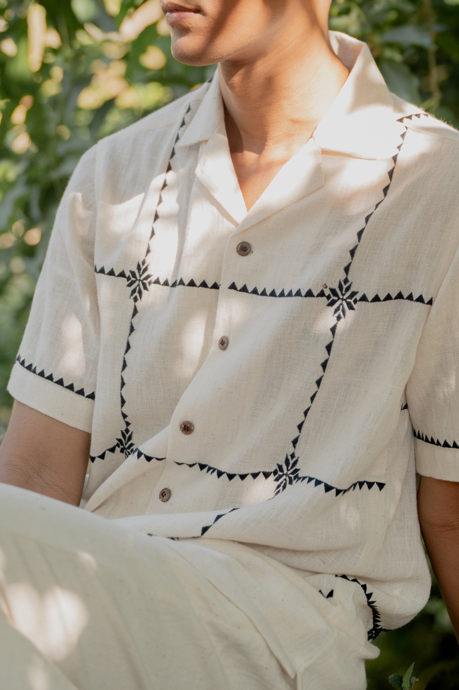 Close of the chequered kala cotton shirt, the cheques embroidered in the suf technique