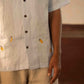 A man in eco-friendly, monkey business hand-embroidered linen shirt in a yoga hall. half sleeves shirt, Material: linen, front view