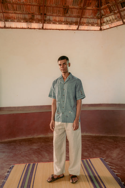 man in eco-friendly hand woven cotton shirt standing in a yoga hall. Half sleeve shirt, Material: cotton, Front view