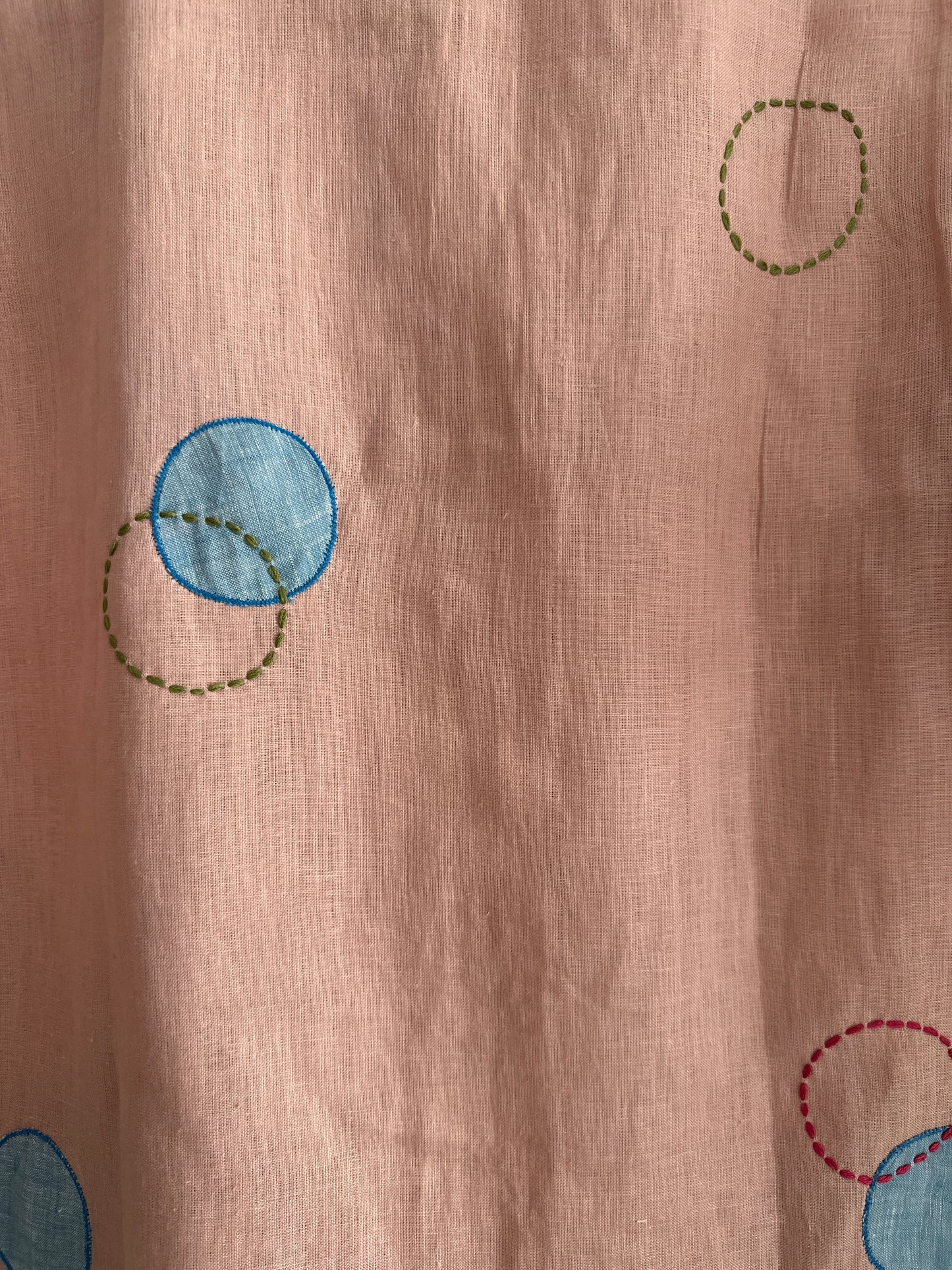 Circles and Disks on peach linen shirt