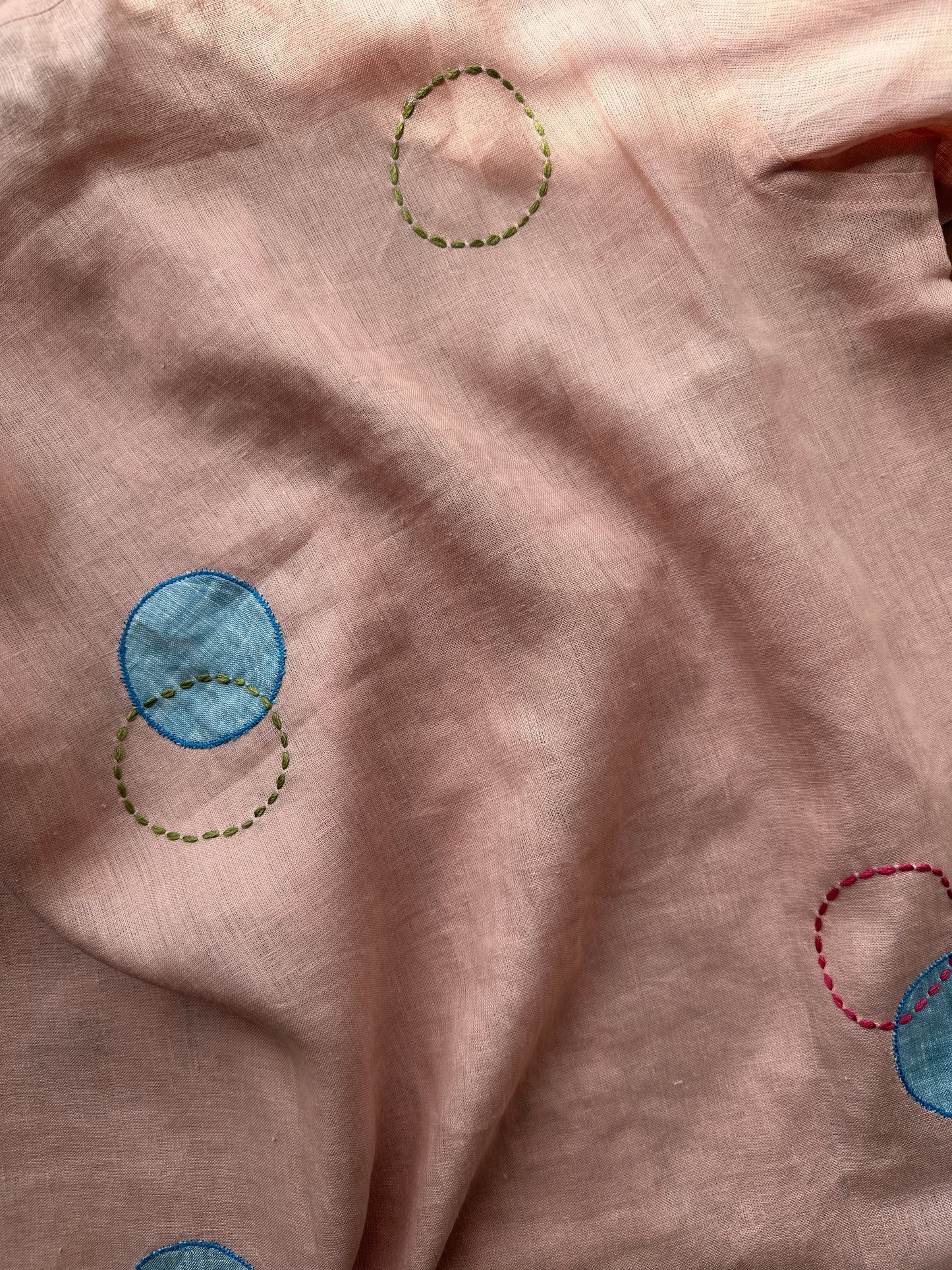 Circles and Disks on peach linen shirt