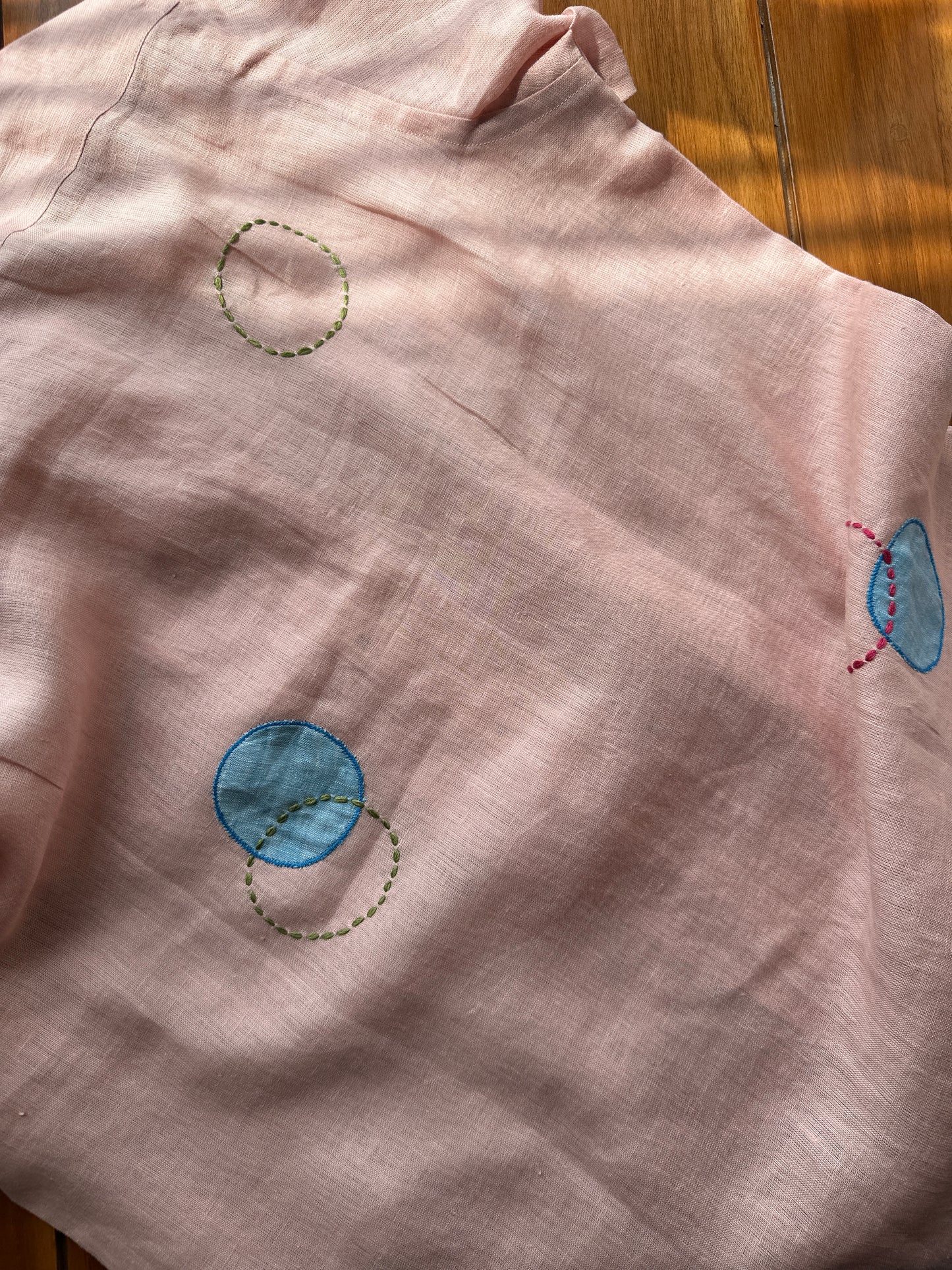 Circles and Disks on peach linen shirt