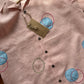 Circles and Disks on peach linen shirt