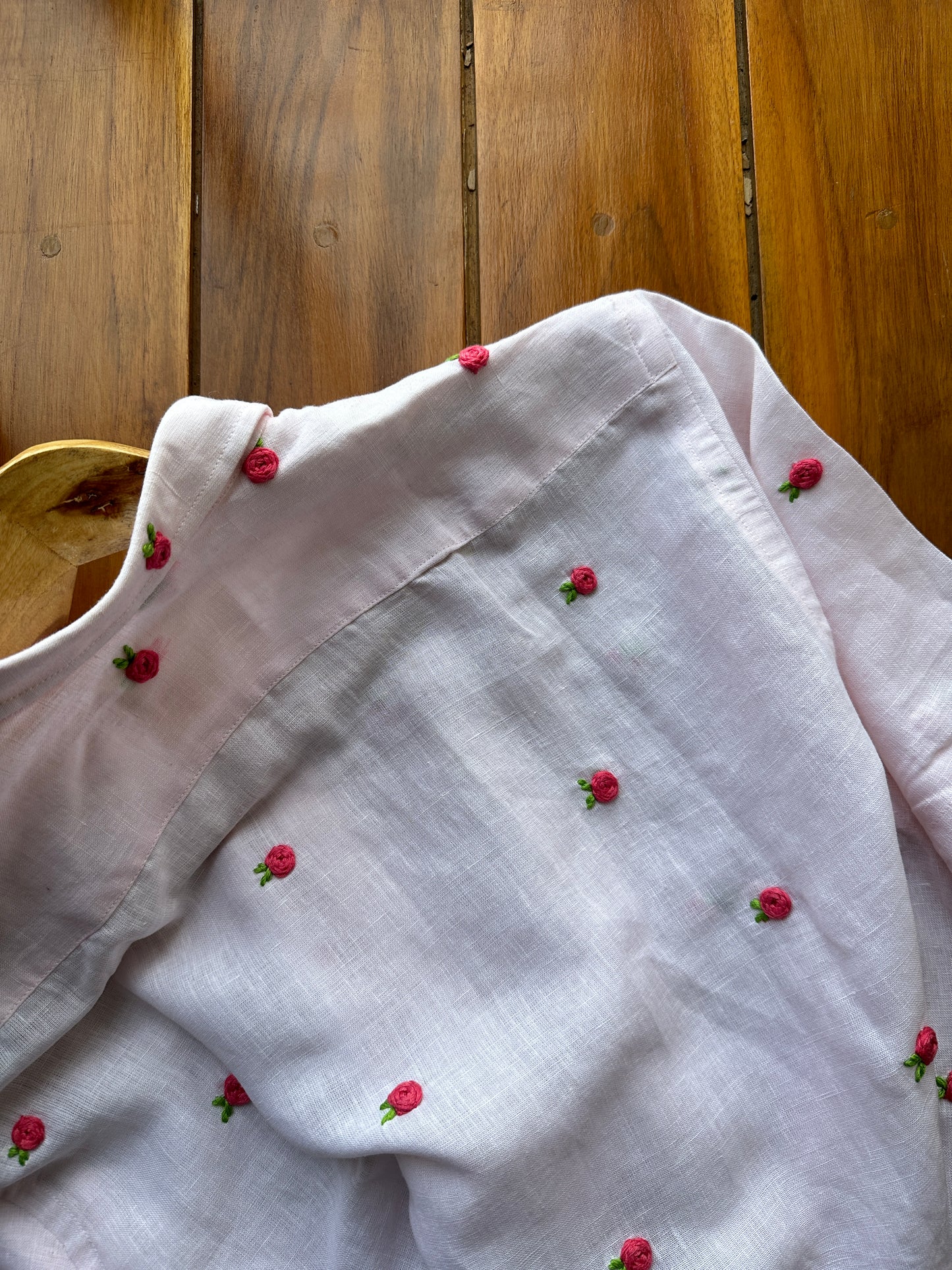 Buds in light pink linen shirt