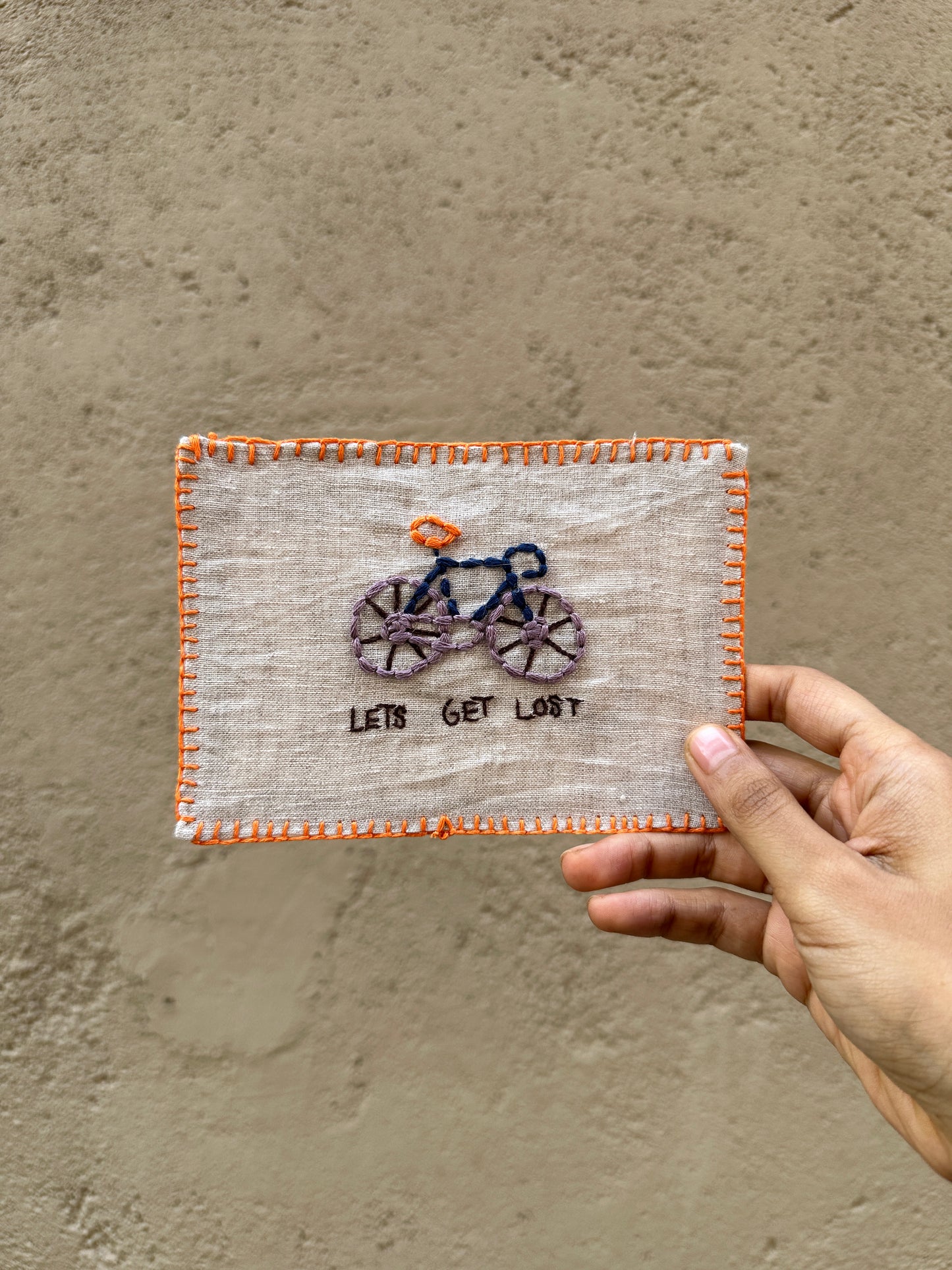 Hand-embroidered postcard featuring a design that evokes adventure and companionship, perfect for those who love to explore