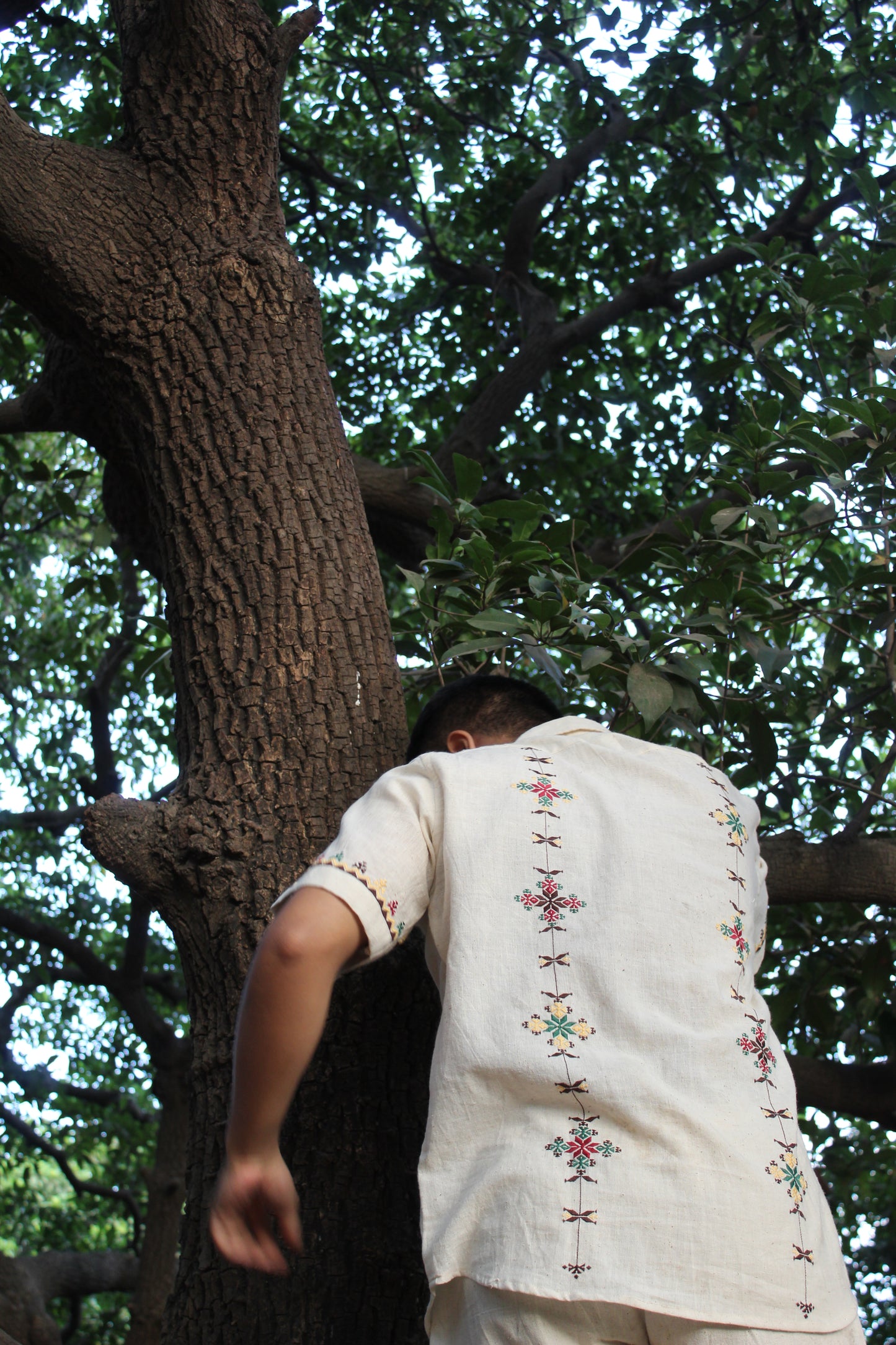 Back of an off-white kala cotton hand-embroidered shirt