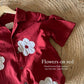 Patchwork flowers in red linen shirt