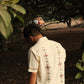 Back of an off-white kala cotton hand-embroidered shirt