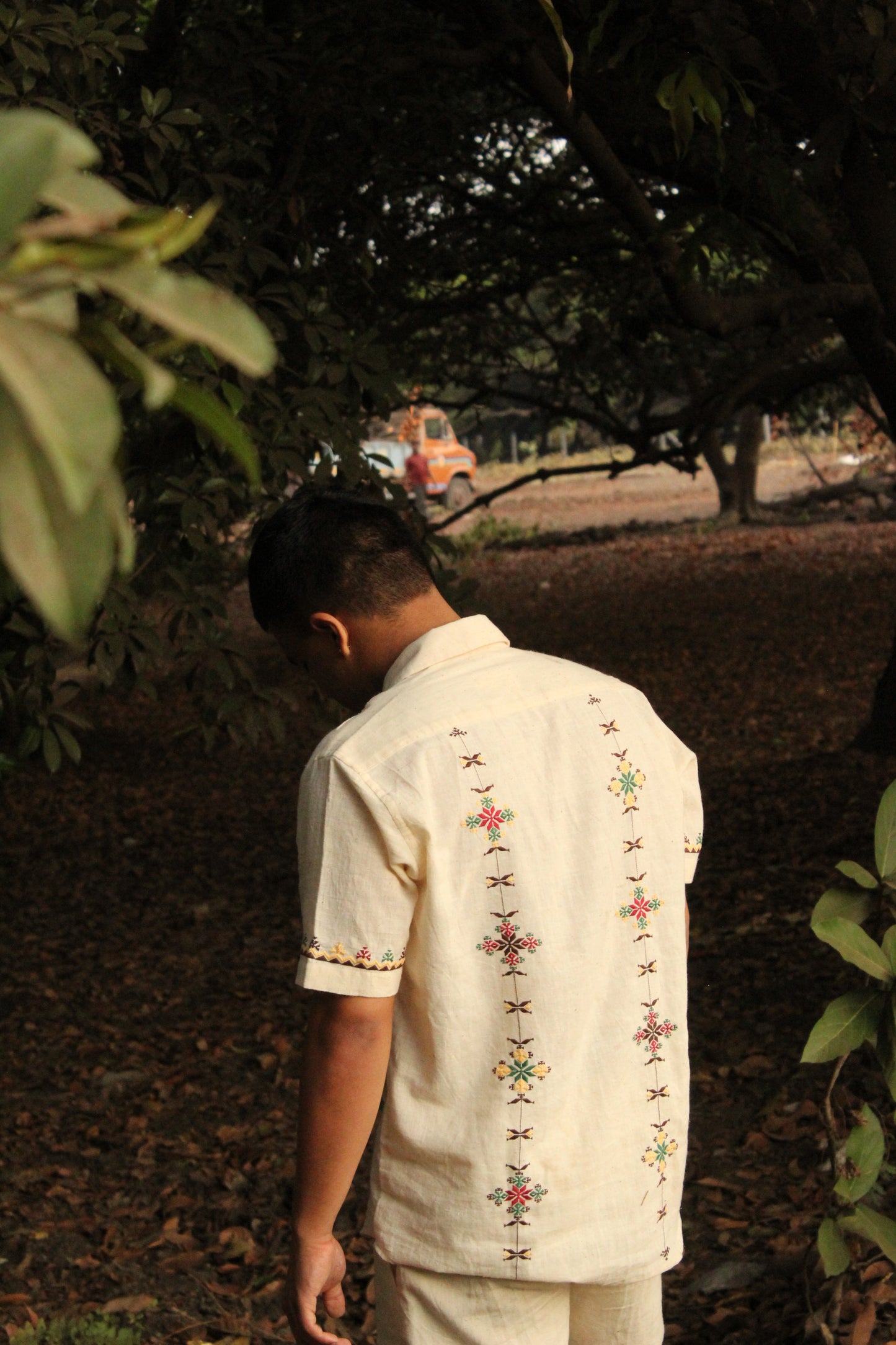 Back of an off-white kala cotton hand-embroidered shirt