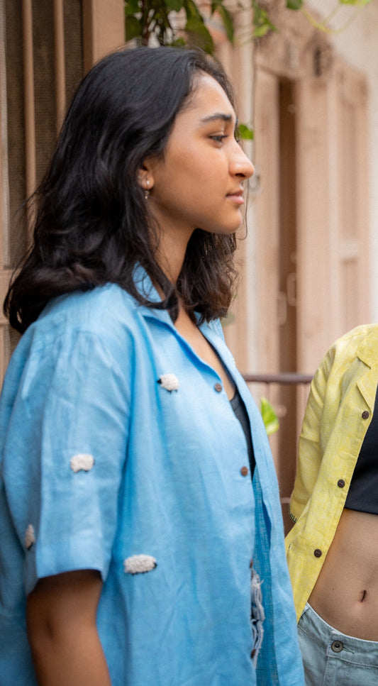 Nishka is wearing a Blue half sleeve linen shirt with small sheep embroidered