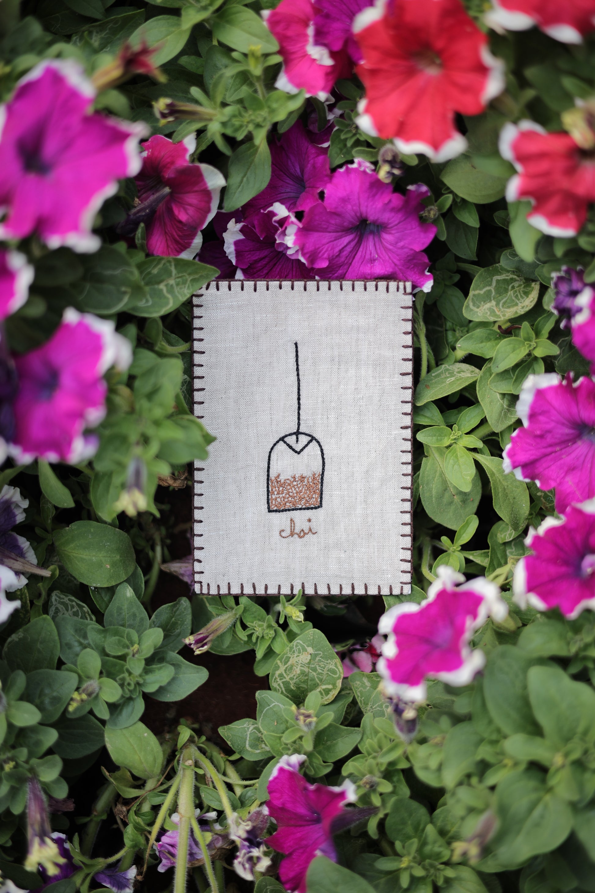 Hand-embroidered postcard featuring a chai tea setup, ideal for inviting someone to a chai date